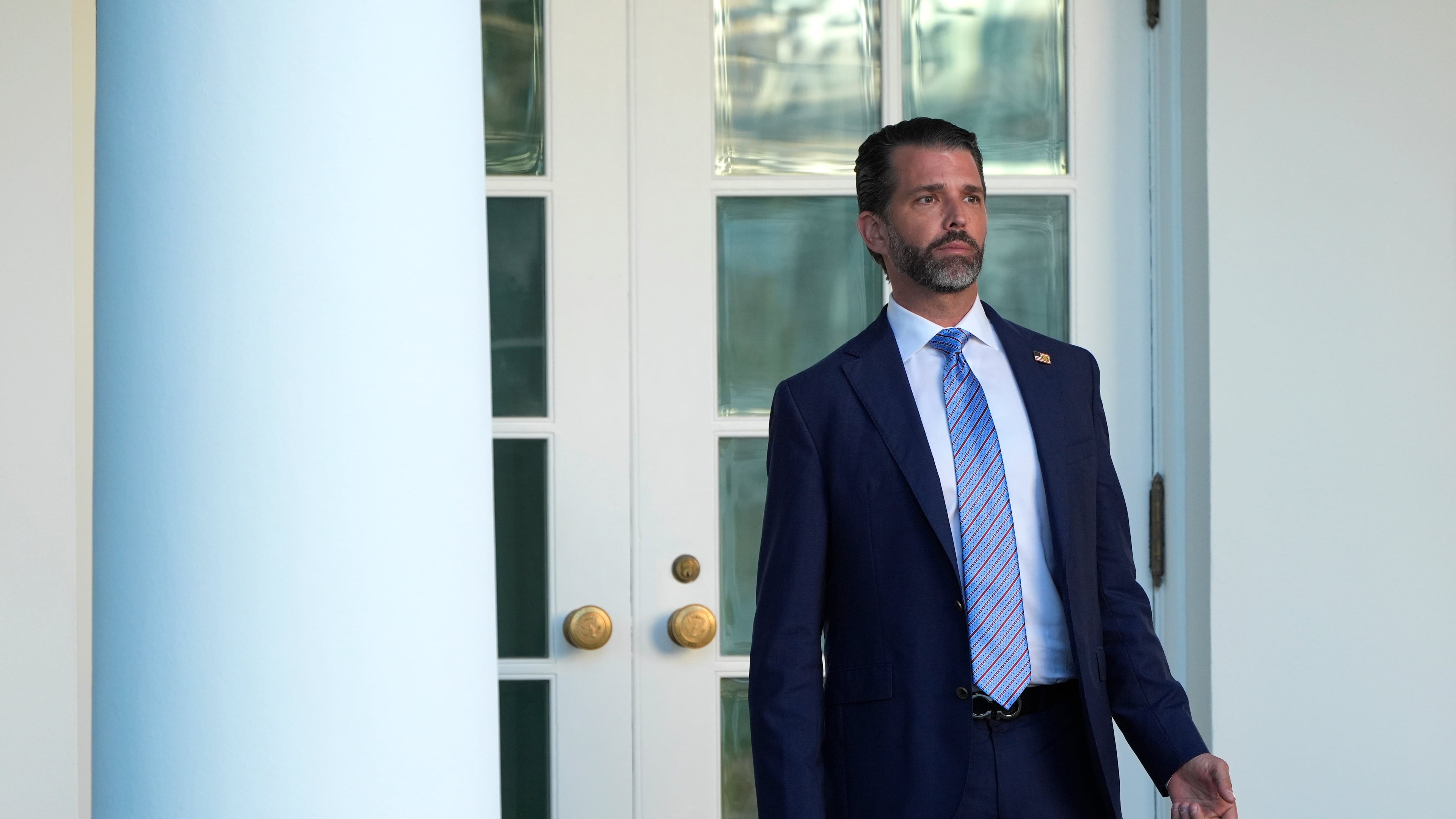 Donald Trump Jr. stands near the Oval Office after a ceremony to present the Presidential Medal of Freedom for Charlie Kirk to his widow Erika Kirk in the Rose Garden of the White House, Tuesday, Oct. 14, 2025, in Washington. (AP Photo/Mark Schiefelbein)