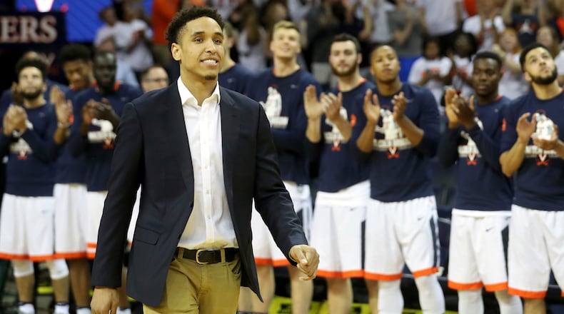 Malcolm Brogdon is introduced during a ceremony to retire his number before the start of a game against Miami, Monday, Feb. 20, 2017, in Charlottesville, Va.