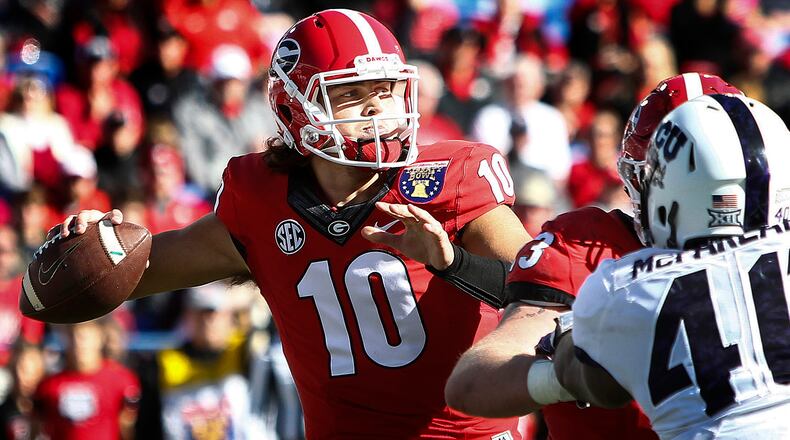 Georgia quarterback Jacob Eason makes a throw against TCU  during the first quarter of the Liberty Bowl Friday, Dec. 30, 2016, in Memphis, Tenn. Georgia' freshman quarterback completed 12 of 21 passes for 164 yards and 2 touchdowns.