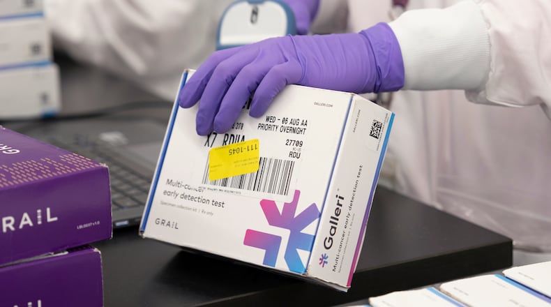 This undated photo provided by Grail Inc. on Tuesday, Sept. 22, 2026, shows an employee scanning a Galleri cancer screening test. (Grail Inc. via AP)