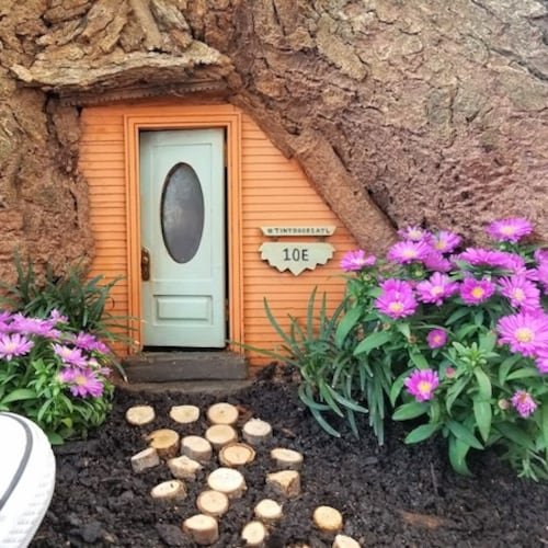 Tiny Doors ATL has installed mini-entryways all over Atlanta, including this one on the Grant Park Trail (suggestion: park nearby in the Gateway garage). (Courtesy of Tiny Doors ATL)