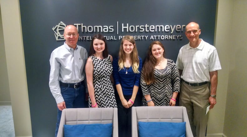 Lanier High students (left to right) Macy Dykes, Savannah Jones and Lauren Eshelman worked with mentors Mark Jones (left) and David Hughes to secure a patent for a makeup product they designed as part of their senior coursework.