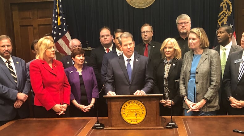Gov. Brian Kemp unveiled a plan Thursday that would invest more than $300 million in public money into reinsurance — money that would be paid to insurance companies and meant to trickle down and lower premium prices. The plan would also require the state to build its own online system that would guide residents to private web brokers who could sell them insurance.