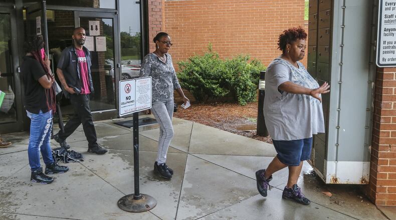 May 30, 2017 Atlanta: Garrett Ingram, the father of Demarco Mosley (left) leaves the Fulton County Jail with family members (right). He voiced frustration he was could not see his son after he waived his first appearance. JOHN SPINK/JSPINK@AJC.COM