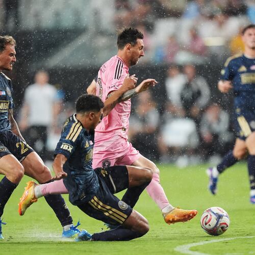 Inter Miami forward Lionel Messi, center, drives forward under pressure from Philadelphia Union forward Augustin Anello, left, and defender Nathan Harriel, bottom, during the second half of an MLS soccer match, Sunday, May 24, 2026, in Miami. (AP Photo/Rebecca Blackwell)