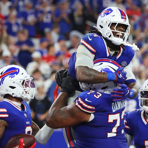 Buffalo Bills running back James Cook (4) celebrates his rushing touchdown against the Detroit Lions during the second half of an NFL football game in Orchard Park, N.Y., Thursday, Sept. 17, 2026. (AP Photo/Jeffrey T. Barnes )