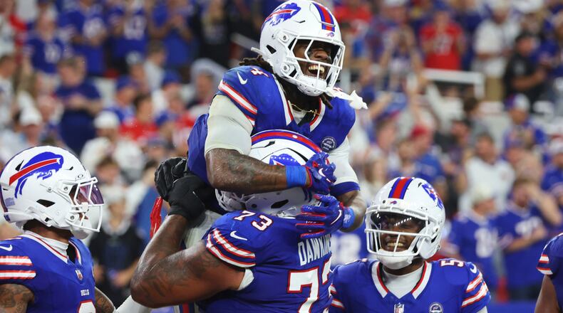 Buffalo Bills running back James Cook (4) celebrates his rushing touchdown against the Detroit Lions during the second half of an NFL football game in Orchard Park, N.Y., Thursday, Sept. 17, 2026. (AP Photo/Jeffrey T. Barnes )