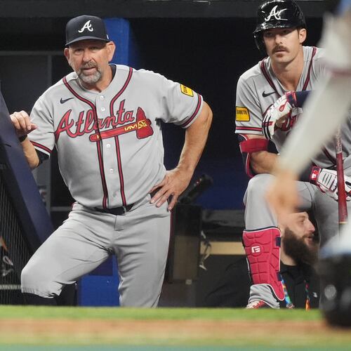 Braves manager Walt Weiss (center) watches his team during a game against the Marlins on May 18, 2026, in Miami. Weiss says communicating with players about lineup changes is key. (Rebecca Blackwell/AP)