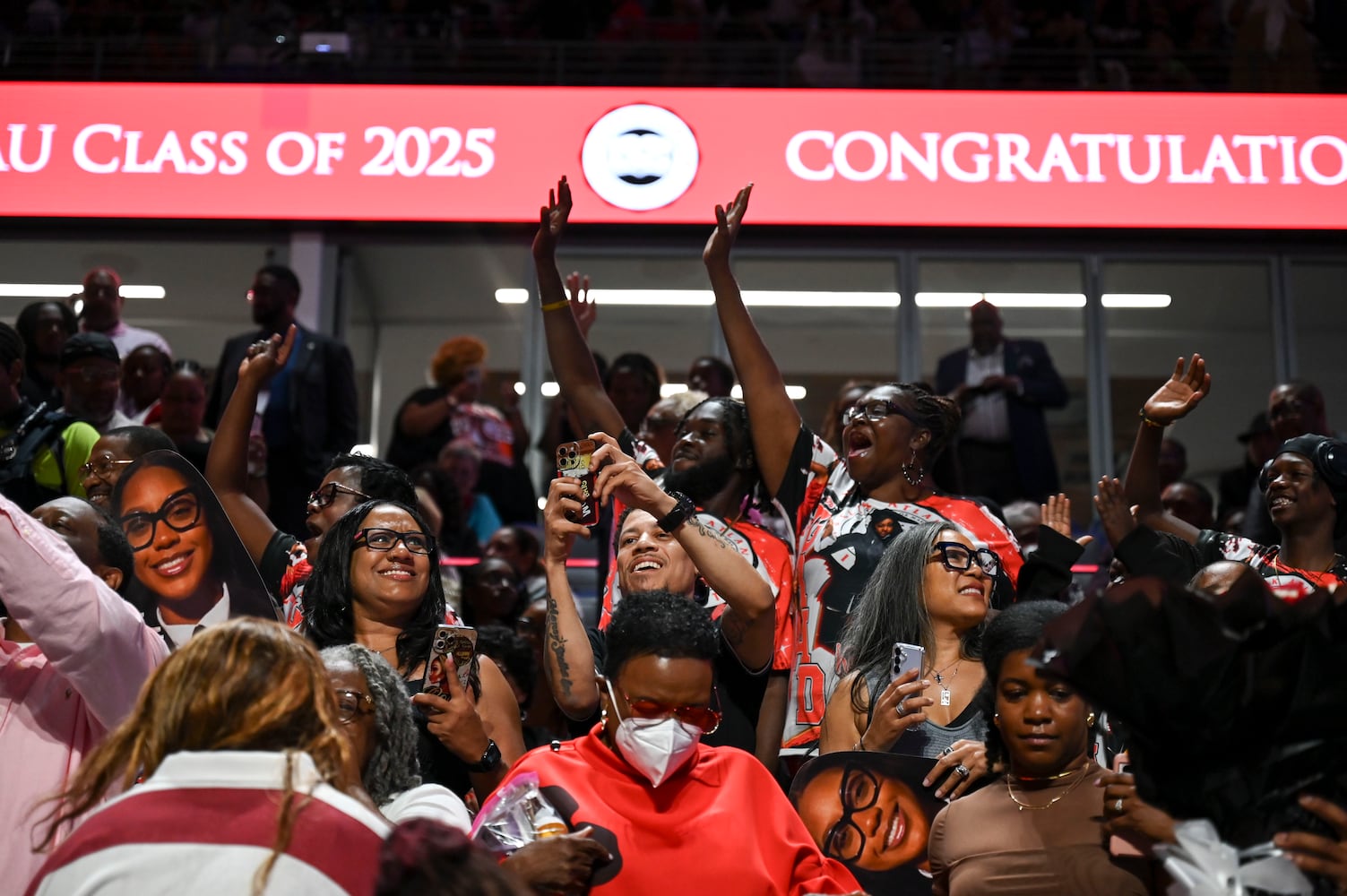 Friends a family snap photos of their graduates during Clark Atlanta University’s 2025 commencement ceremony Sunday, May 18, 2025 at Georgia State’s Convocation Center. (Daniel Varnado/For the Atlanta Journal-Constitution)