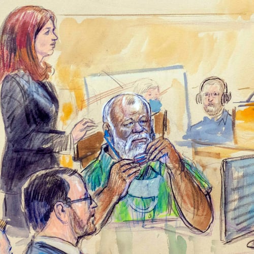 The artist sketch depicts Assistant U.S. Attorney Erik Kenerson, front left, watching as Whitney Minter, a public defender from the eastern division of Virginia, stands to represent Abu Agila Mohammad Mas'ud Kheir Al-Marimi, accused of making the bomb that brought down Pan Am Flight 103 over Lockerbie, Scotland, in 1988, in federal court in Washington, Dec. 12, 2022, as Magistrate Judge Robin Meriweather listens. (Dana Verkouteren via AP)
