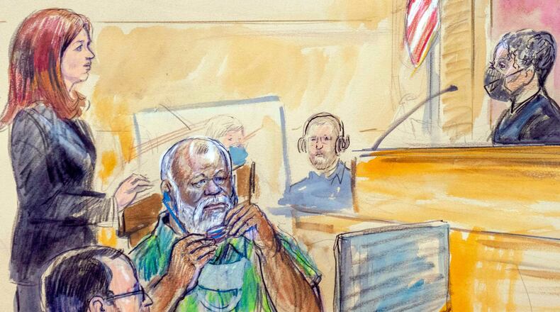 The artist sketch depicts Assistant U.S. Attorney Erik Kenerson, front left, watching as Whitney Minter, a public defender from the eastern division of Virginia, stands to represent Abu Agila Mohammad Mas'ud Kheir Al-Marimi, accused of making the bomb that brought down Pan Am Flight 103 over Lockerbie, Scotland, in 1988, in federal court in Washington, Dec. 12, 2022, as Magistrate Judge Robin Meriweather listens. (Dana Verkouteren via AP)
