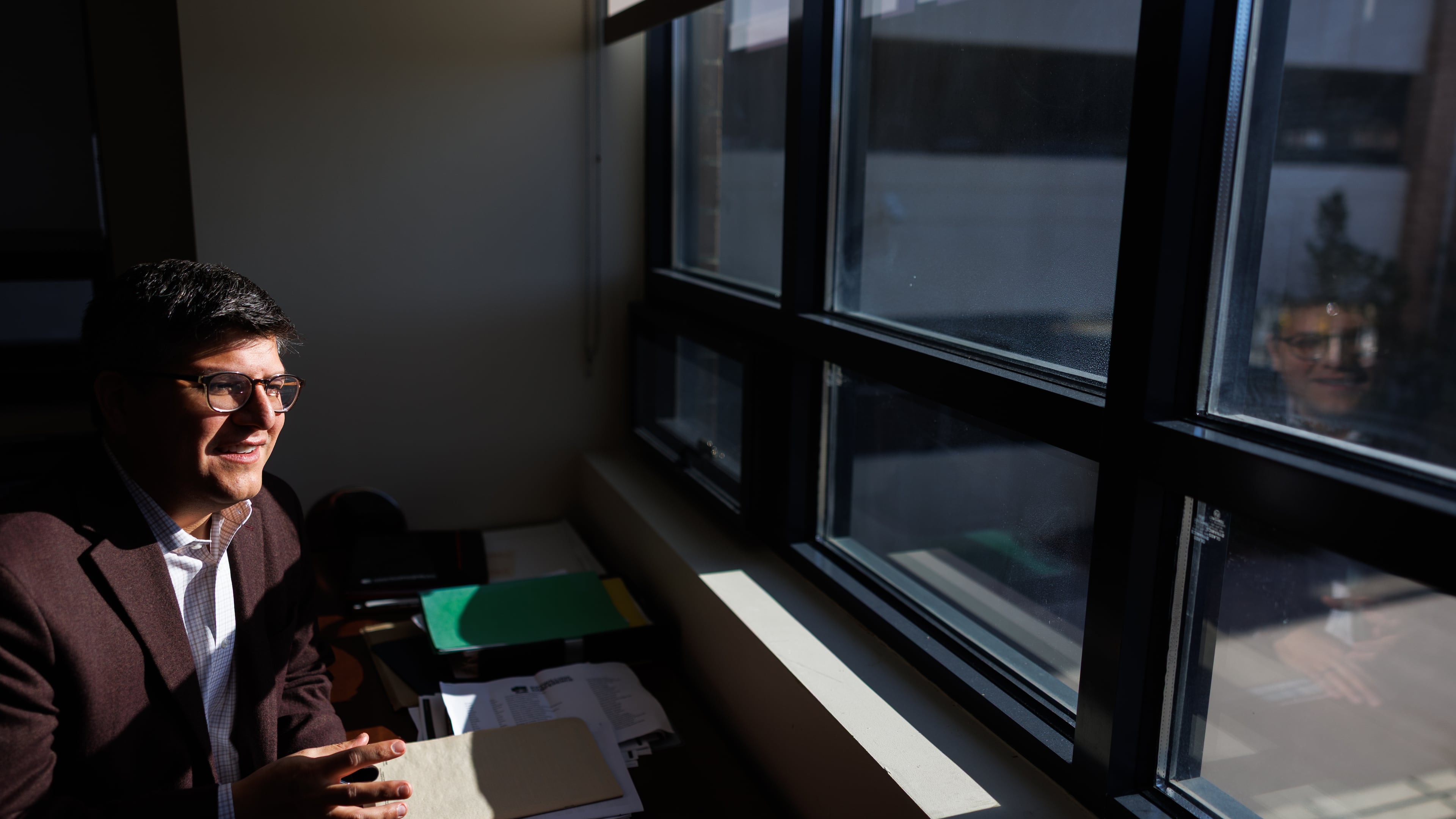 Juan Espinoza, vice provost for enrollment management at Virginia Tech, poses for a photo in his office, Nov. 12, 2025, in Blacksburg, Va. (AP Photo/Shaban Athuman)
