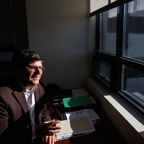Juan Espinoza, vice provost for enrollment management at Virginia Tech, poses for a photo in his office, Nov. 12, 2025, in Blacksburg, Va. (AP Photo/Shaban Athuman)