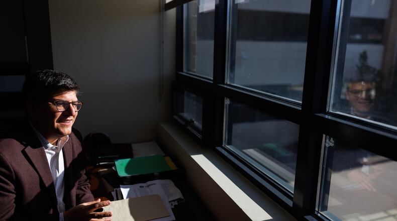 Juan Espinoza, vice provost for enrollment management at Virginia Tech, poses for a photo in his office, Nov. 12, 2025, in Blacksburg, Va. (AP Photo/Shaban Athuman)
