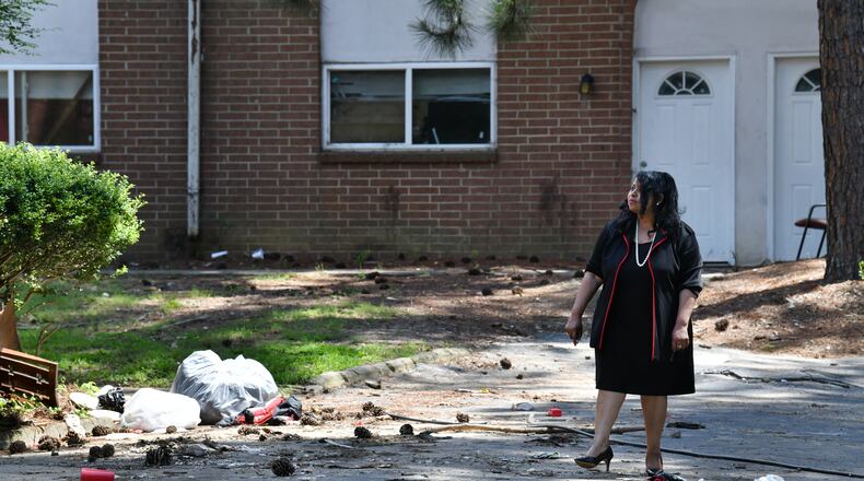 July 15, 2022 Atlanta - Atlanta City Councilwoman Andrea Boone, who introduced the resolution urging a crackdown of negligent landlords, checks conditions of one of negligent apartment buildings at Vue at Harwell in Atlanta on Friday, July 15, 2022. The Atlanta City Council formally urged law enforcement officials to pursue charges against negligent apartment landlords, in response to an Atlanta Journal-Constitution investigation into the issue. (Hyosub Shin / Hyosub.Shin@ajc.com)