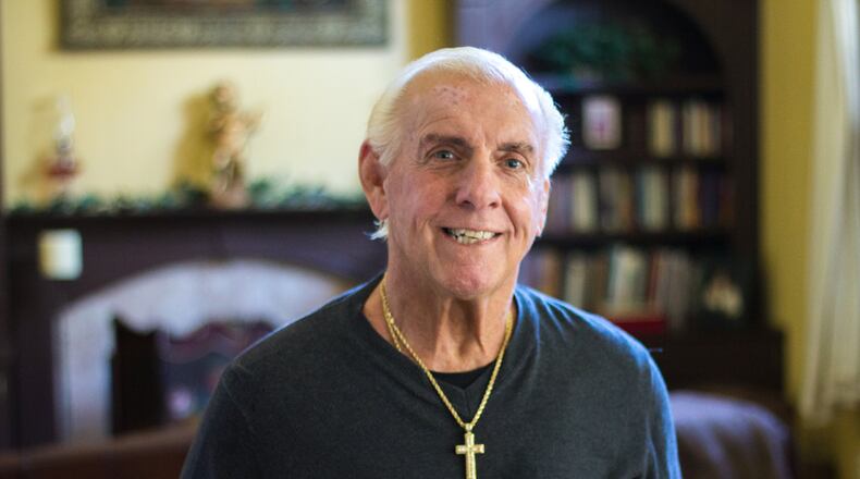 Ric Flair, shown at his Lawrenceville home in October, was given a less than 1 in 5 chance to live after he fell ill in August. He says his medical bills for the recent emergency ran above $1 million, and that his recovery included learning to walk again. CONTRIBUTED BY AVERY NEWMARK