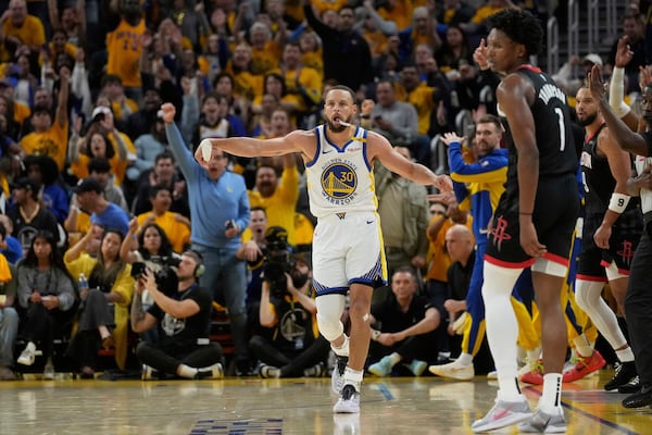 Golden State Warriors guard Stephen Curry (30) celebrates after making a 3-point basket during the second half of Game 3 of an NBA basketball first-round playoff series against the Houston Rockets in San Francisco, Saturday, April 26, 2025. (AP Photo/Jeff Chiu)