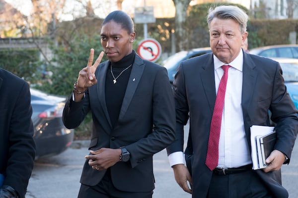 FILE - In this Feb. 18, 2019, file photo, Caster Semenya, left, current 800-meter Olympic gold medalist and world champion, and her lawyer Gregory Nott, right, arrive for the first day of a hearing at the international Court of Arbitration for Sport, CAS, in Lausanne, Switzerland. (Laurent Gillieron/Keystone via AP, File)