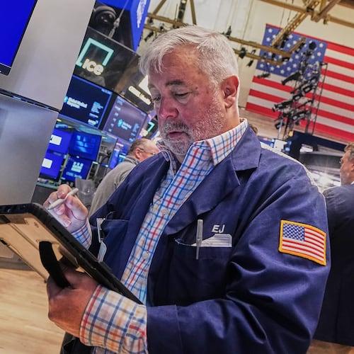 Trader Edward McCarthy works on the floor of the New York Stock Exchange, Wednesday, May 13, 2026. (AP Photo/Richard Drew)