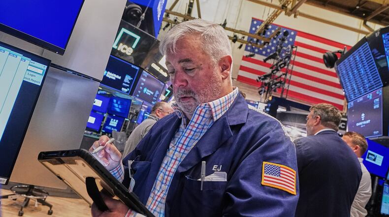 Trader Edward McCarthy works on the floor of the New York Stock Exchange, Wednesday, May 13, 2026. (AP Photo/Richard Drew)