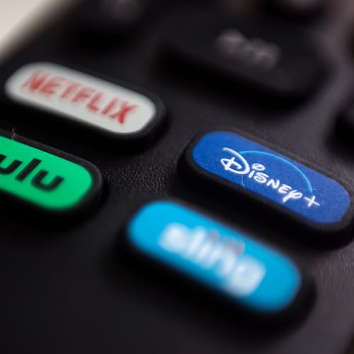 FILE - The logos for streaming services Netflix, Hulu, Disney Plus and Sling TV are pictured on a remote control on Aug. 13, 2020, in Portland, Ore. (AP Photo/Jenny Kane, File)