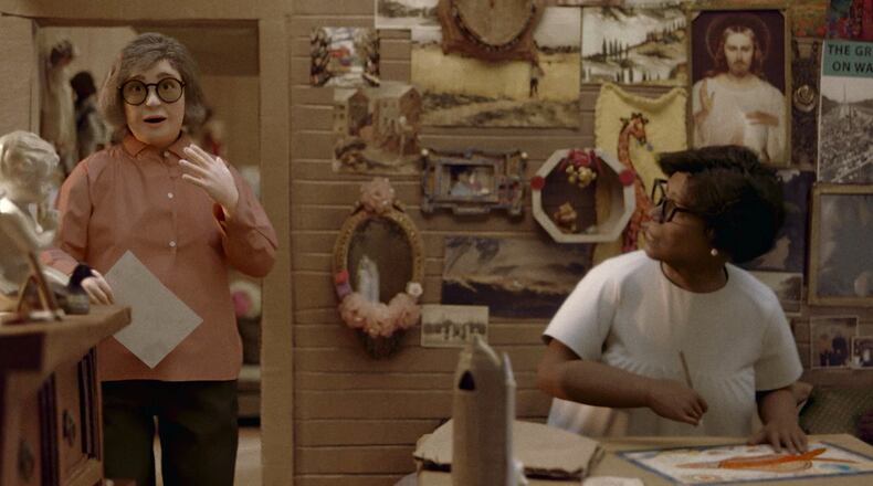 "This World is Not My Own" is an artful account of the life of visionary self-taught Georgia artist Nellie Mae Rowe; the movie was created with the use of intricate sets and motion-capture technology. In a scene from the film, an animated Rowe (right) works on a drawing at her cluttered house while her gallerist and advocate Judith Anderson wanders into the frame. Courtesy of Petter Ringbom
