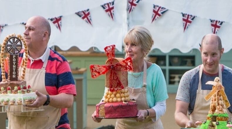Finalists Luis Troyano (from left), Nancy Birtwhistle and Richard Burr carry their showstoppers out of the tent to greet family, friends and former contestants at the end of the 2014 finale. 
Courtesy of BBC