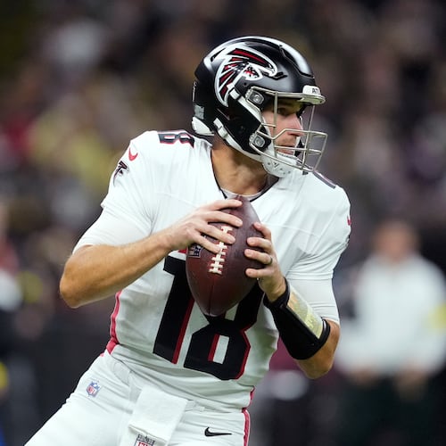 Atlanta Falcons quarterback Kirk Cousins drops back to pass against the New Orleans Saints in the first half of an NFL football game, Sunday, Nov. 23, 2025, in New Orleans. (AP Photo/Gerald Herbert)