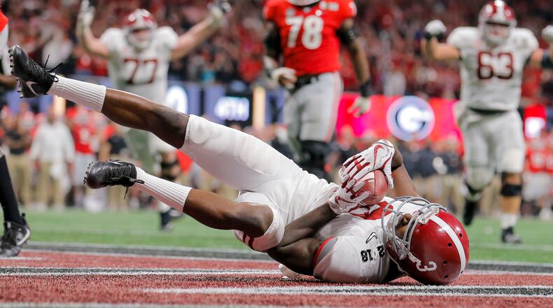 Former Alabama wide receiver Calvin Ridley lands on his back after successfully catching a touchdown pass during the fourth quarter of the College Football Playoff National Championship game at Mercedes-Benz stadium Jan. 8.