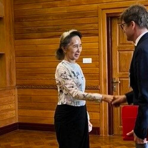 In this photo released by Myanmar President Office on Monday, Aug. 3, 2026, Myanmar's ousted leader Aung San Suu Kyi, left, shakes hands with Arnaud de Baecque, resident representative of the International Committee of the Red Cross, during their meeting in Naypyitaw, Myanmar. (Myanmar President Office via AP)