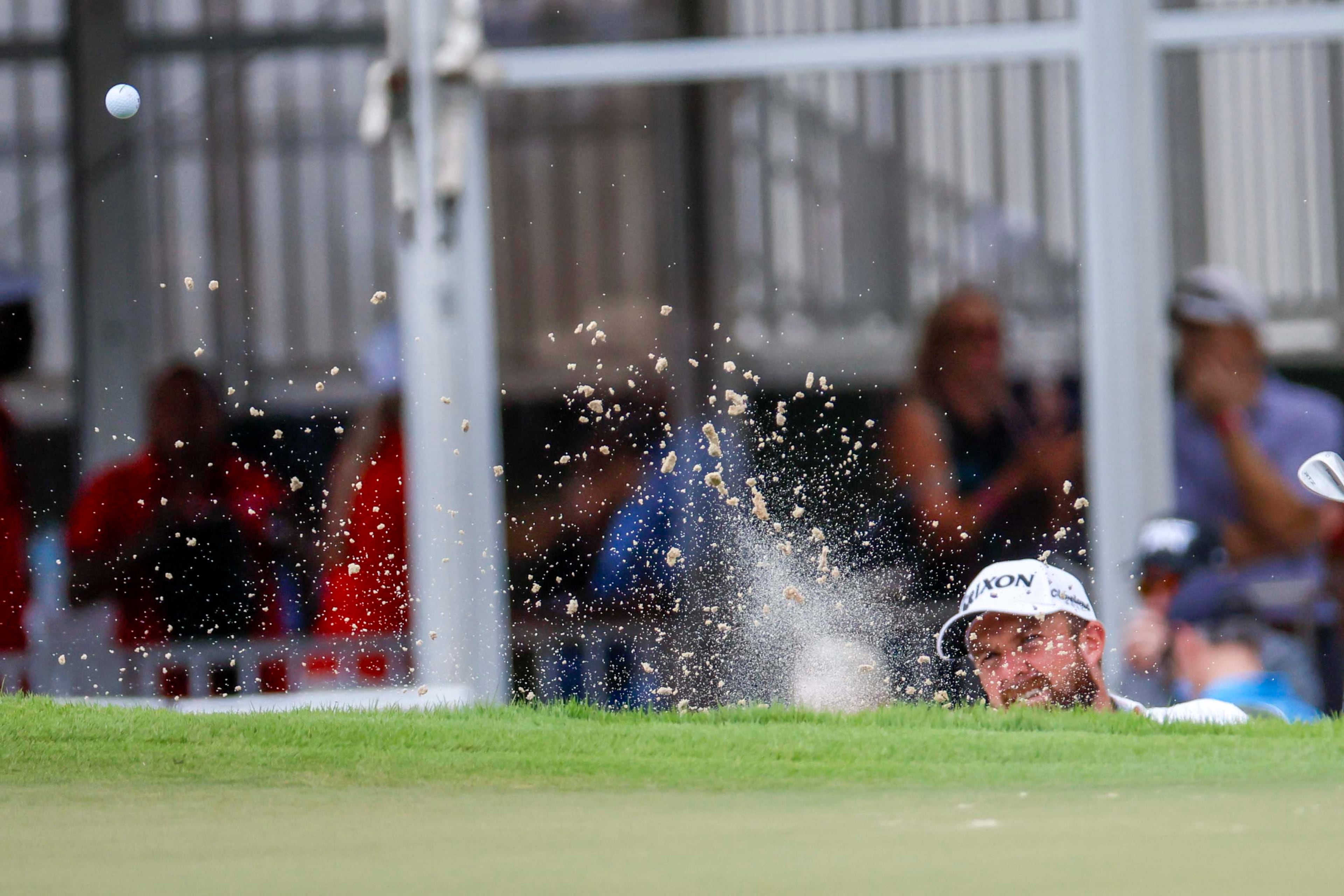 Shane Lowry, of Ireland, chips out of the bunker on the third hole during the final round of the PGA Tour Championship at East Lake Golf Club, on Sunday, Aug. 24, 2025, in Atlanta. (Miguel Martinez/ AJC)