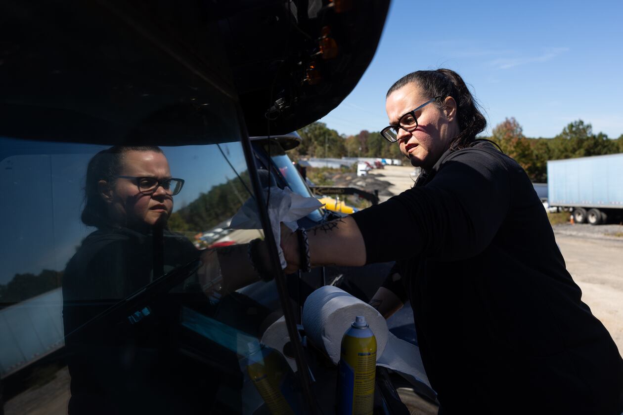 Jessica Graham applies Rain-X to the windshield of her truck in Lithonia. (Elijah Nouvelage for The Atlanta Journal-Constitution)