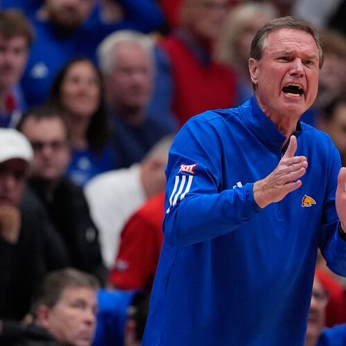 Kansas head coach Bill Self motions to his team during the first half of an NCAA college basketball game against Baylor, Friday, Jan. 16, 2026, in Lawrence, Kan. (AP Photo/Charlie Riedel)