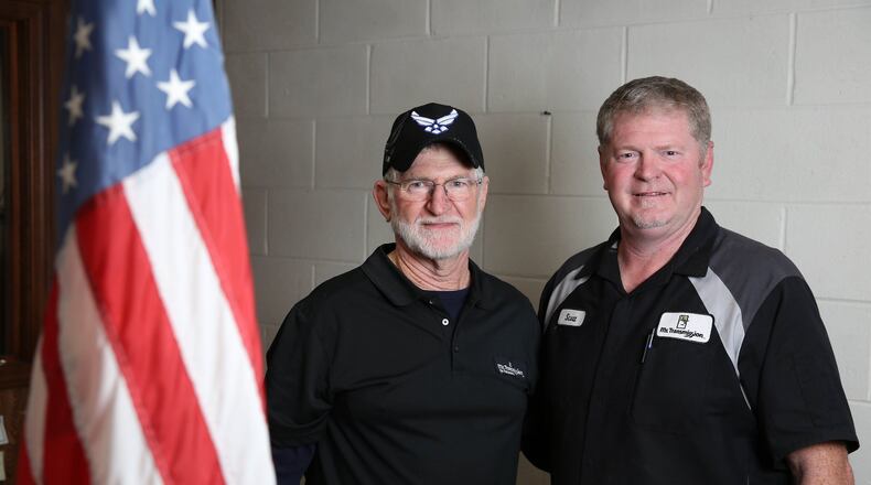 U.S. military veterans Lowell Hester, left, and his son Scott at their business, Mr. Transmission, Thursday, November 9, 2017, in Sandy Springs. Twice in the last three years, the Hester’s business, Mr. Transmission, have been named the Franchisee of the year. PHOTO / JASON GETZ
