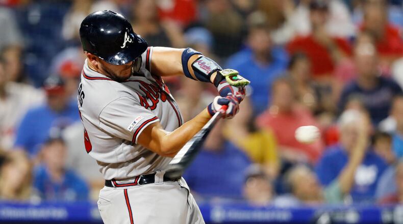 Atlanta Braves' Tyler Flowers hits a three-run home run off Philadelphia Phillies starting pitcher Zach Eflin during the fourth inning of a baseball game Wednesday, Sept. 11, 2019, in Philadelphia. (AP Photo/Matt Slocum)