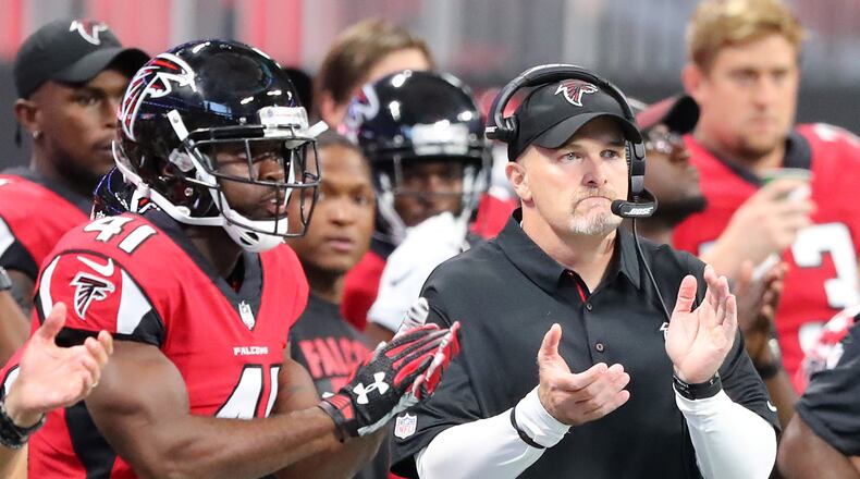 No shortage of encouragement on the Falcons sidelines: Head coach Dan Quinn applauds his defense earlier this season. (Curtis Compton/ccompton@ajc.com)