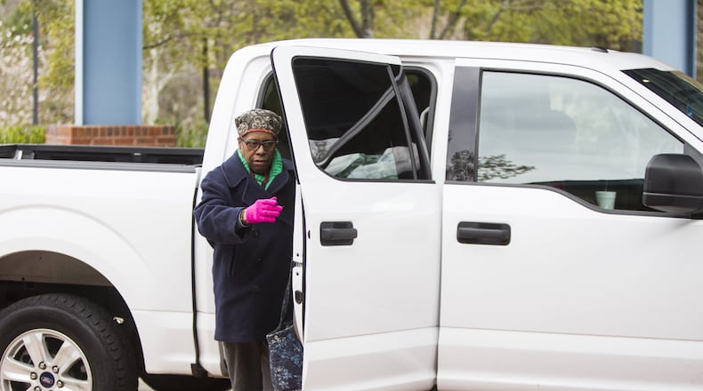 Anne Spencer exits an Uber in front of the Dorothy C. Benson Senior Complex in Sandy Springs, Georgia, on Thursday, March 8, 2018. The complex uses a liaison to schedule Uber and Lyft rides for the senior community. (REANN HUBER/REANN.HUBER@AJC.COM)