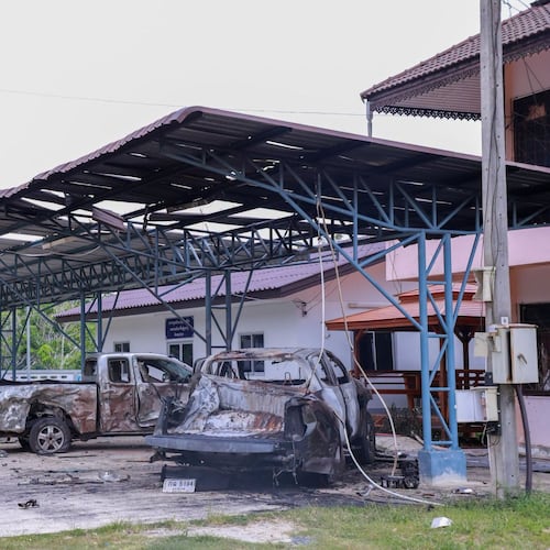 This image provided by The Government's Internal Security Operations Command, shows vehicles damaged the night before by arson at a local government office in Sri Sakhon Subdistrict in Narathiwat province, Thailand, Sunday, Aug. 23, 2026. (The Government's Internal Security Operations Command via AP)