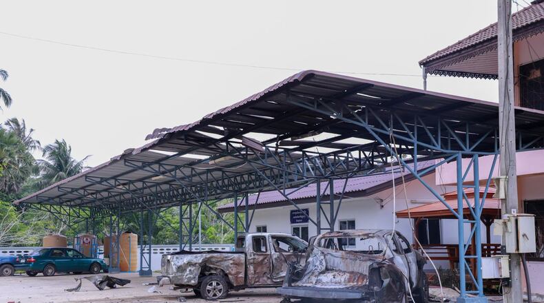 This image provided by The Government's Internal Security Operations Command, shows vehicles damaged the night before by arson at a local government office in Sri Sakhon Subdistrict in Narathiwat province, Thailand, Sunday, Aug. 23, 2026. (The Government's Internal Security Operations Command via AP)