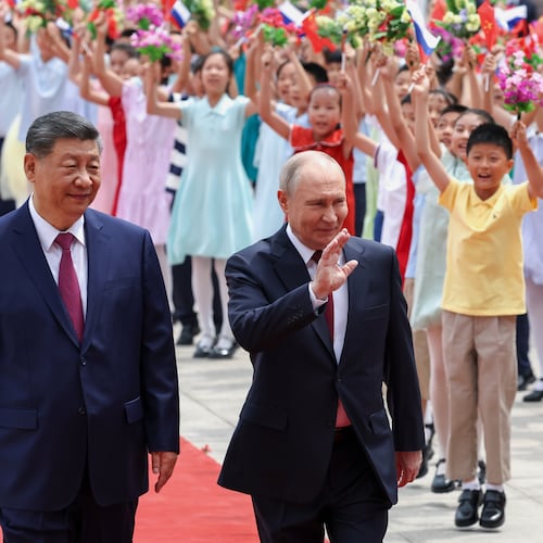 Russian President Vladimir Putin, center, and Chinese President Xi Jinping attend a welcome ceremony at the Great Hall of the People, in Beijing, China, on Wednesday, May 20, 2026. (Alexander Kazakov, Sputnik, Kremlin Pool Photo via AP)