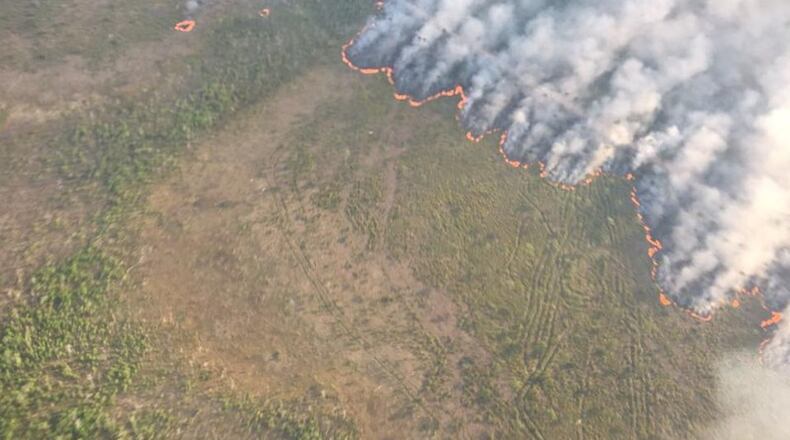 A massive wildfire in Okefenokee National Wildlife Refuge may not be fully contained until Nov. 1, meaning smoke from the blaze could hit Georgia and Florida’s beaches this summer. Credit: Okefenokee National Wildlife Refuge