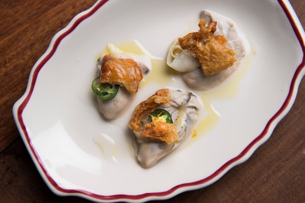 Pickled Oysters with Lardo and Serrano Peppers and Chicken Skin, prepared by the chef Mashama Bailey at the Houseman restaurant in New York, April 20, 2016. (Evan Sung/The New York Times)