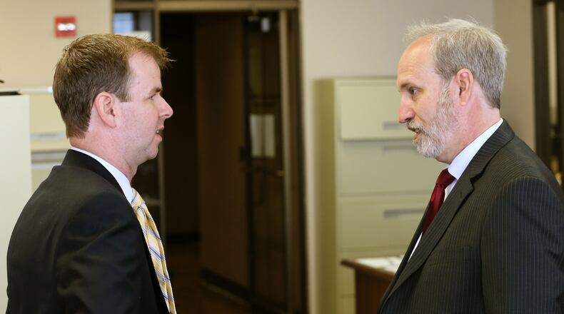 Stefan Ritter, (right) executive director of the state ethics commission, is trying to get local officials to pay up fees they’ve been assessed for failing to file documents like campaign reports on time. BOB ANDRES / BANDRES@AJC.COM