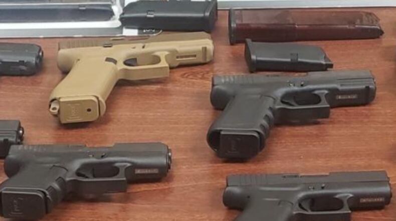 A 24-year-old Georgia man faces gun and drug charges after he allegedly sold 25 guns and cocaine to an undercover officer in New York, according to the U.S. Drug Enforcement Administration.