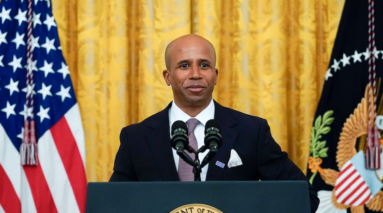 Dr. Edjah Nduom, associate professor, Department of Neurosurgery, Emory University School of Medicine, speaks during a "Cancer Moonshot," event in the East Room of the White House, Wednesday, Feb. 2, 2022, in Washington. (AP Photo/Alex Brandon)