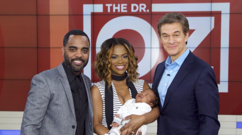 Kandi Burruss with husband Todd Tucker and baby Ace on the Dr. Oz show. Photo: Sony Pictures Television