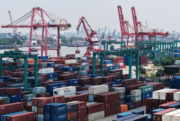 Machines loading container at a container terminal, in Shanghai, China on Wednesday, May 14, 2025. (Chinatopix Via AP)