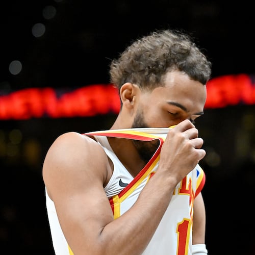 Atlanta Hawks guard Trae Young (11) takes a moment before a preseason NBA basketball game against Houston Rockets at State Farm Arena, Thursday, October 16, 2025, in Atlanta. (Hyosub Shin / AJC)