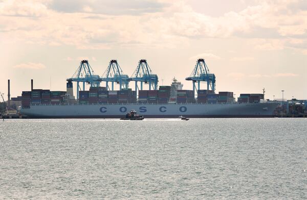The container ship COSCO Development, which arrived at the Port of Virginia overnight, sits docked at Virginia International Gateway in Portsmouth, Va., Monday, May 8, 2017. The COSCO Development, the biggest ship to ever call on the East Coast, pulled into the port Monday and will head out early Tuesday morning. (Kristen Zeis/The Virginian-Pilot via AP)
