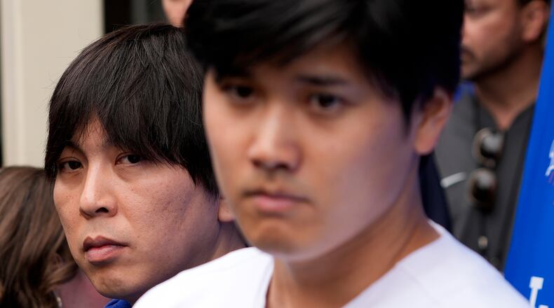 FILE - Ippei Mizuhara, left, stands next to Los Angeles Dodgers player Shohei Ohtani, right, during an interview at Dodger Stadium, Feb. 3, 2024. (AP Photo/Richard Vogel, File)